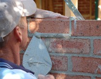 Bricklayer with trowel